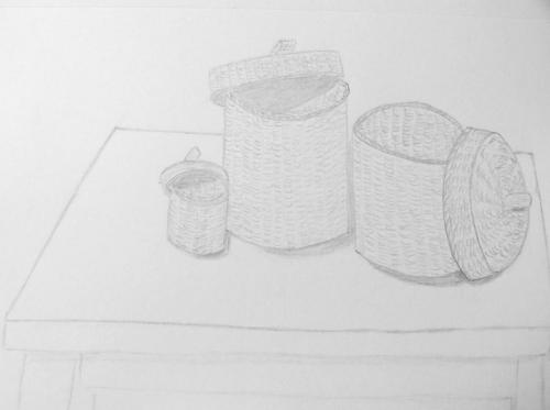 161- Baskets on a table.